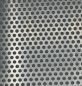 Preview: Aluminium Lochblech Rv 5-8, 1,5mm stark, Nahaufnahme der runden Lochung Preview: Aluminium Lochblech Rv 5-8, 1,5mm stark, Nahaufnahme der runden Lochung